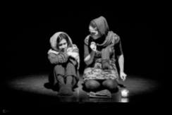 Alyssa Marie Warncke and Mozhgan Rabbany as refugees in the production "Dina Bakh" (2015). Photo by Karlo Walz